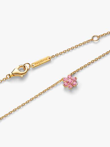 Halsband med hängsmycke och glittrande rosa blomma