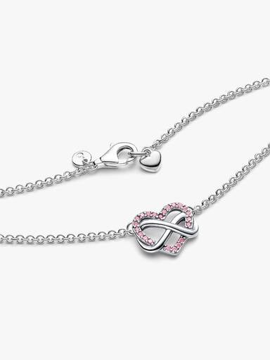 Collierhalsband med gnistrande rosa hjärta i oändlighetsdesign