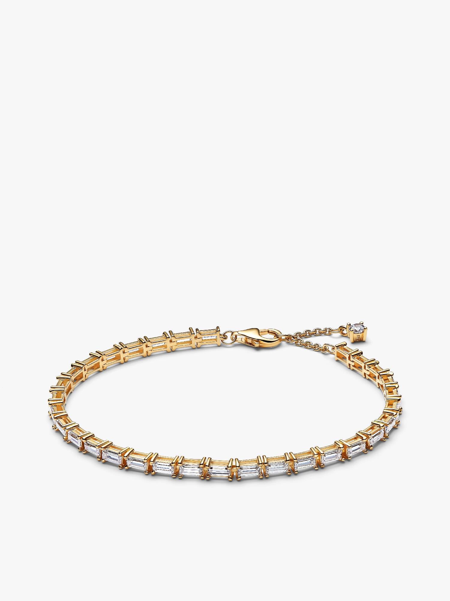 Glittrande tennisarmband med baguetteslipade stenar