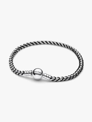 Flätat armband med svart tygdetalj