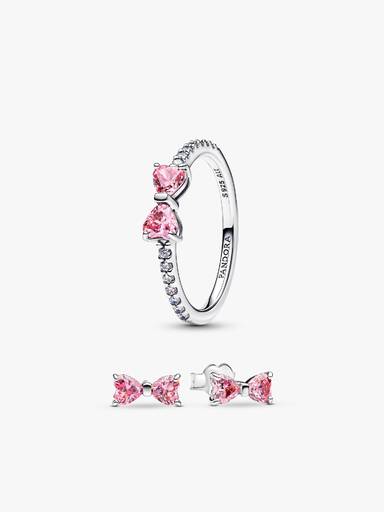 Glittrande rosa ringar med rosett