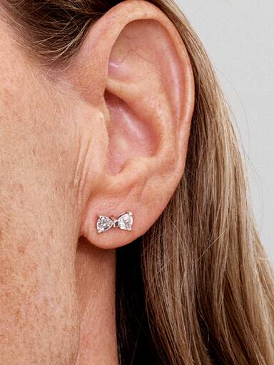 Stiftörhängen med glittrande rosett