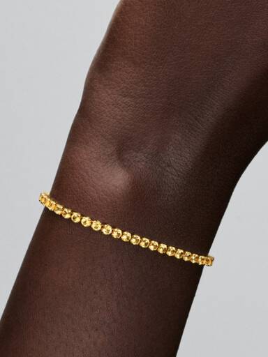 Glittrande gult tennisarmband