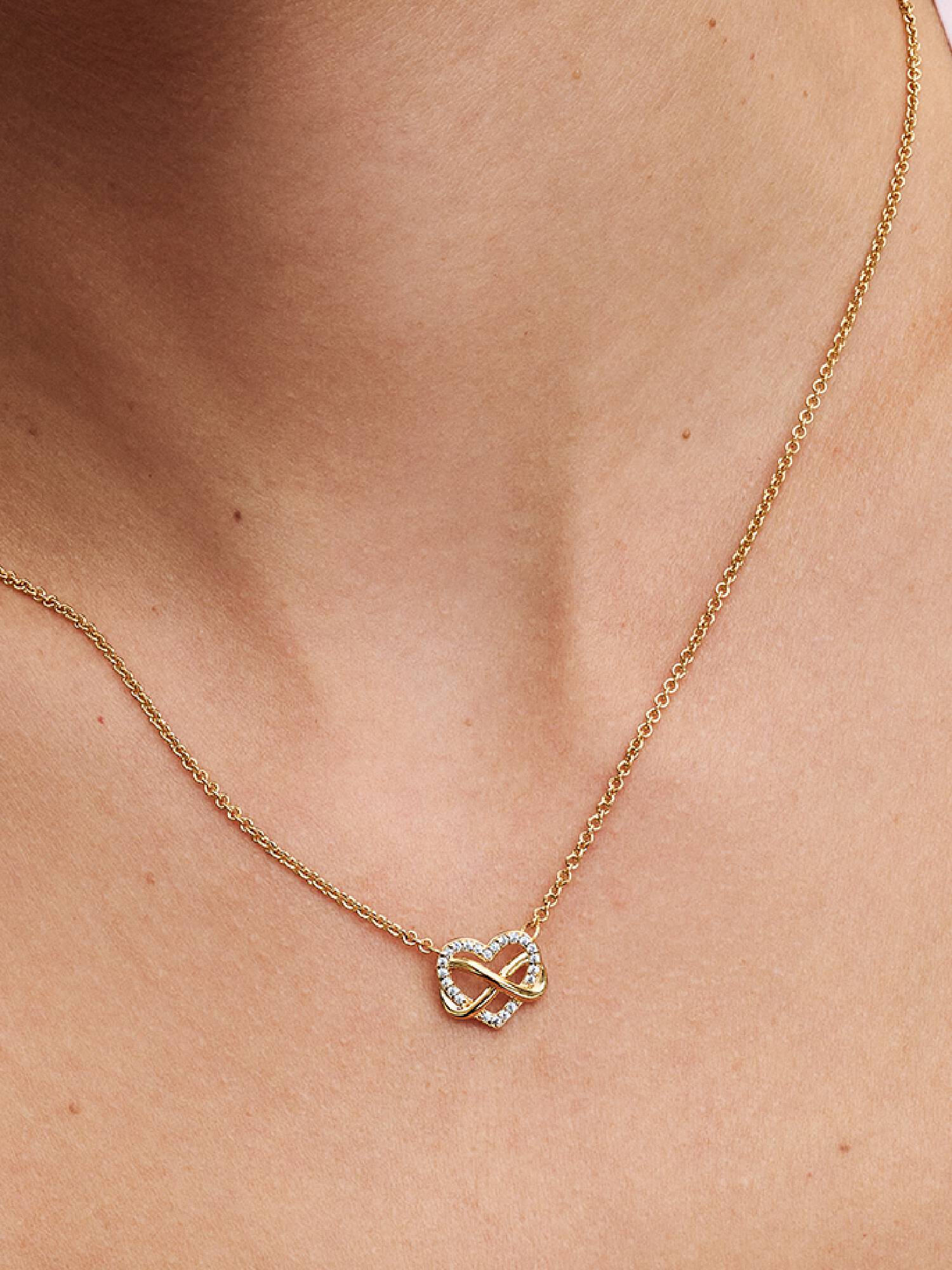 Glittrande halsband med evighetstecken