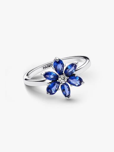 Ring med glittrande blomma