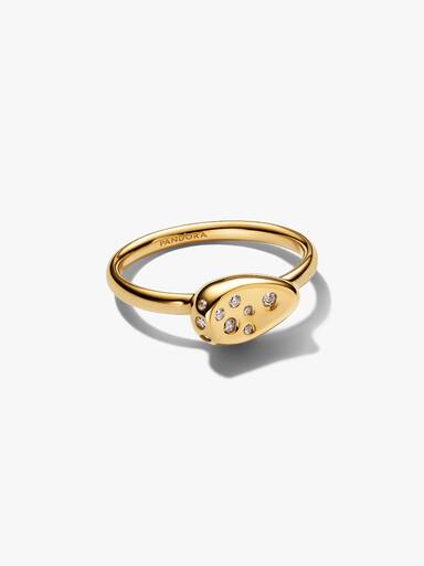 Liten guldpläterad ring med stenar