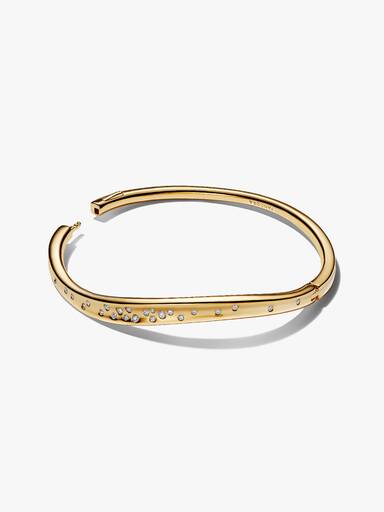 Organiskt formad och glittrande armring