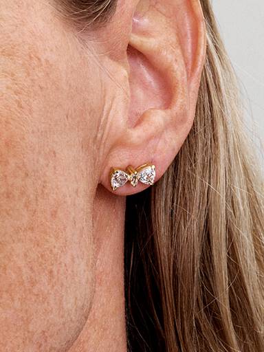 Stiftörhängen med glittrande rosett
