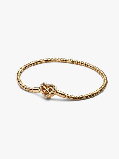 Glittrande ormkedjearmband med hjärtlås