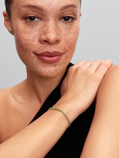 Glittrande grönt tennisarmband