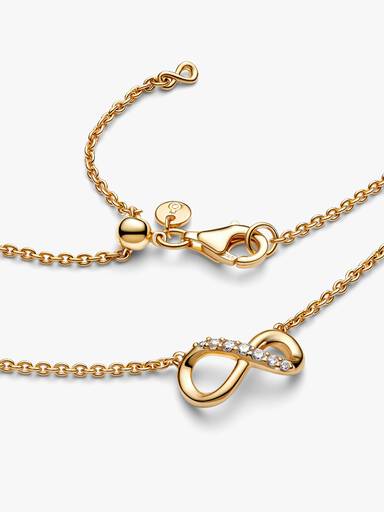 Glittrande halsband med evighetssymbol