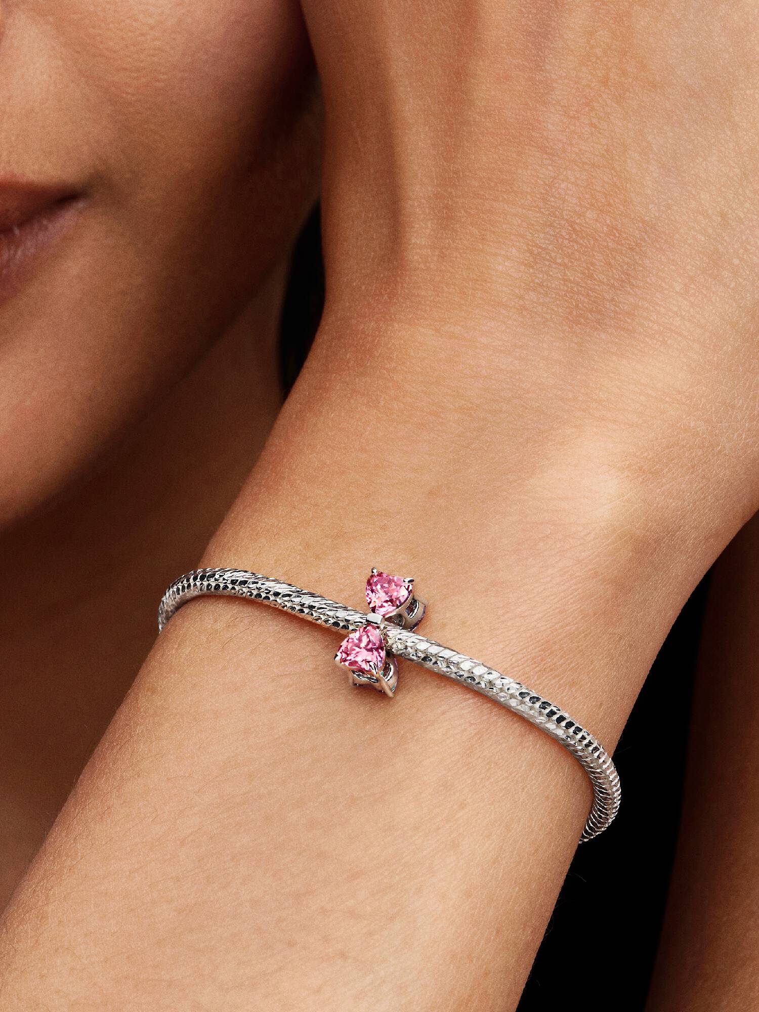 Berlock med rosa rosett