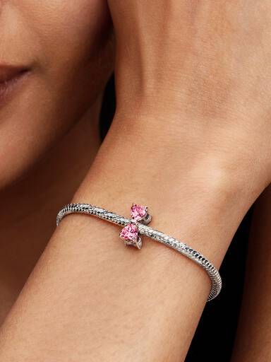 Berlock med rosa rosett