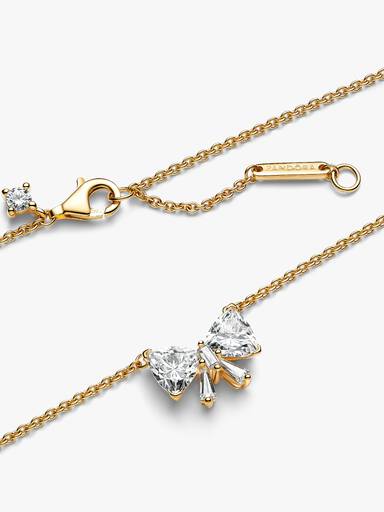 Halsband med glittrande rosett