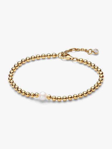 Armband med behandlad sötvattensodlad pärla och metallpärlor
