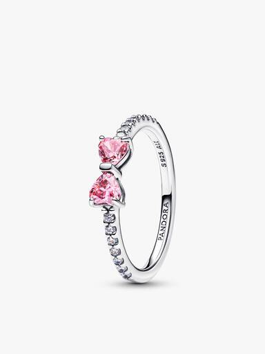 Glittrande rosa ringar med rosett