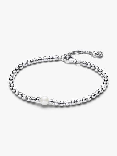 Armband med behandlad sötvattensodlad pärla och metallpärlor