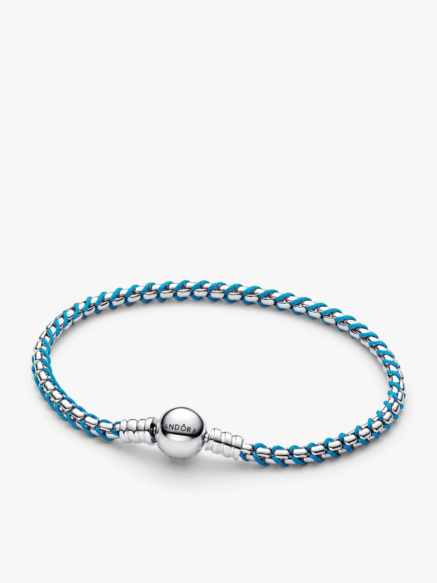 Flätat armband med turkos tygdetalj